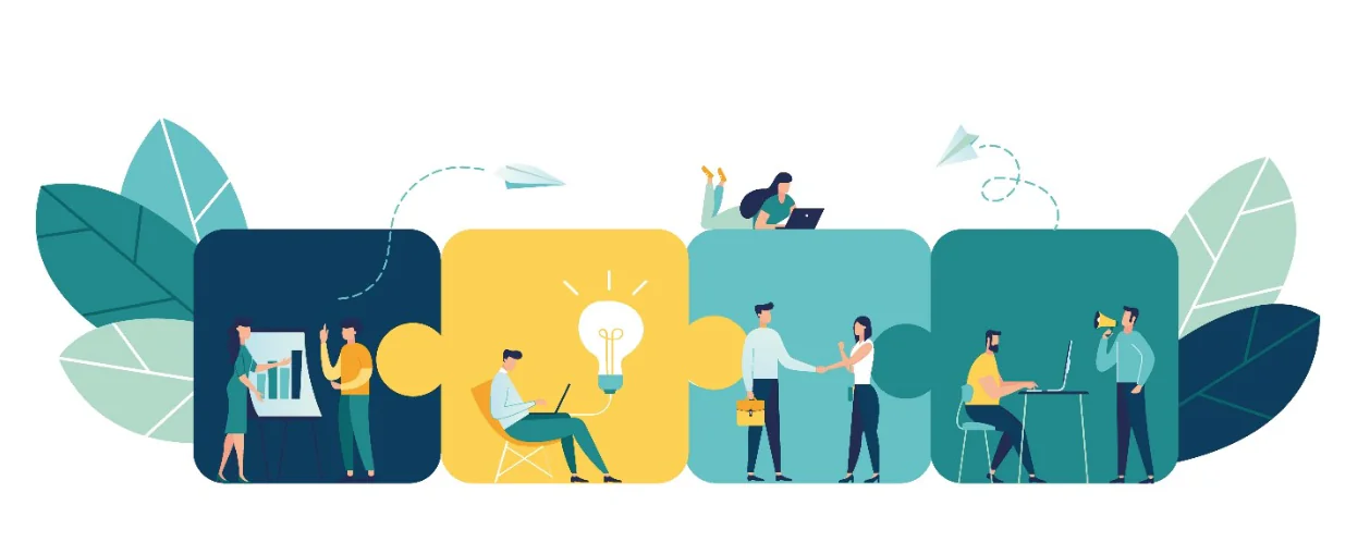 Persone che collaborano in team su puzzle colorati, simbolo di idee e partnership nella progettazione eLearning