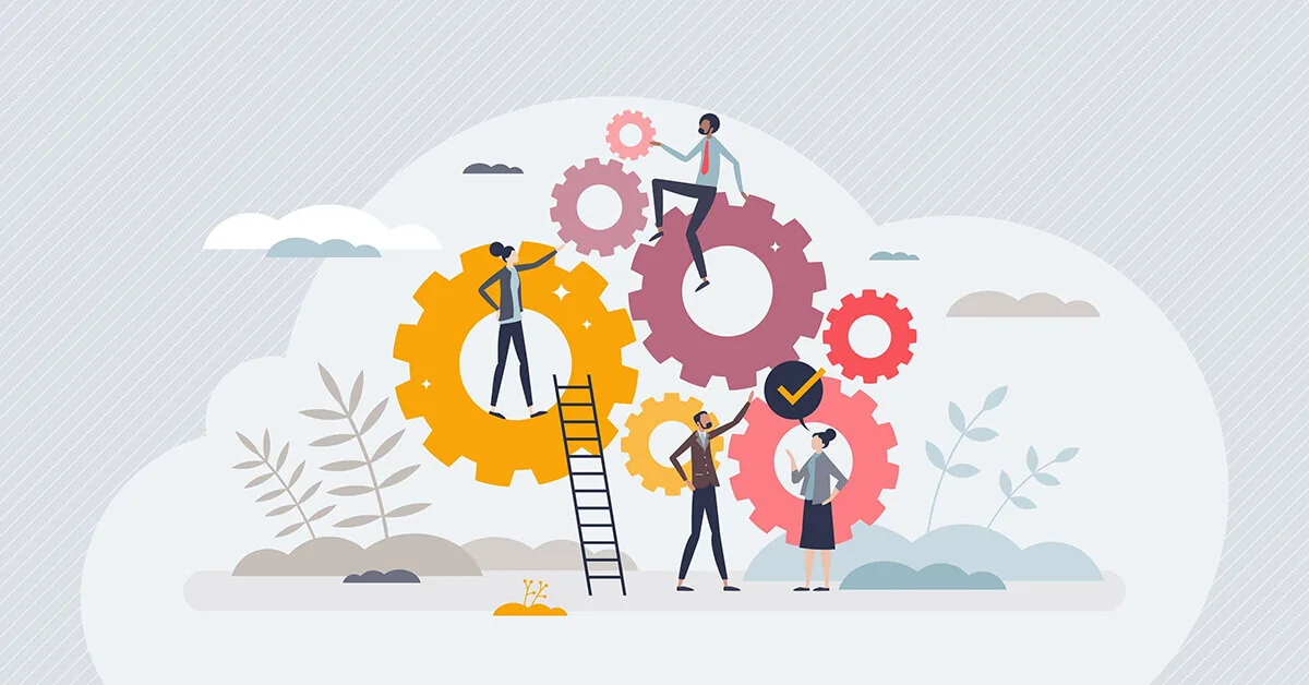 Persone che collaborano su grandi ingranaggi colorati, simbolo della progettazione di scenari interattivi nei corsi eLearning