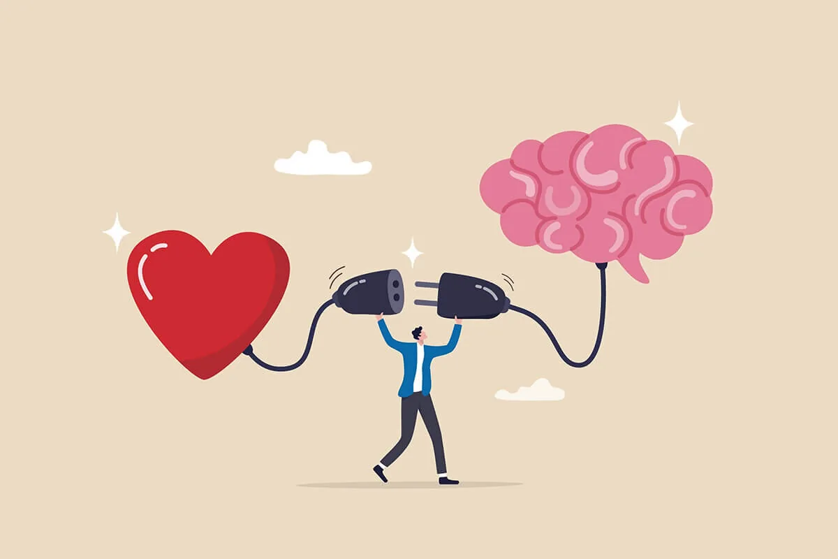 Un uomo collega un cuore rosso e un cervello rosa con due spine, simbolo della connessione tra emozioni e razionalità