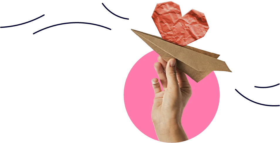 Mano che tiene un aeroplanino di carta con cuore rosso sopra un cerchio rosa, simbolo di celebrazione e passione