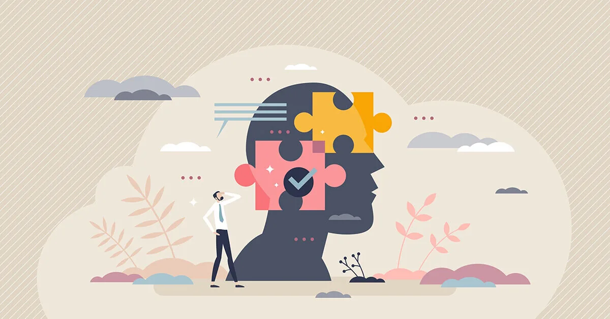 Figura osserva una testa stilizzata composta da pezzi di puzzle che rappresentano la riflessione e le strategie metacognitive