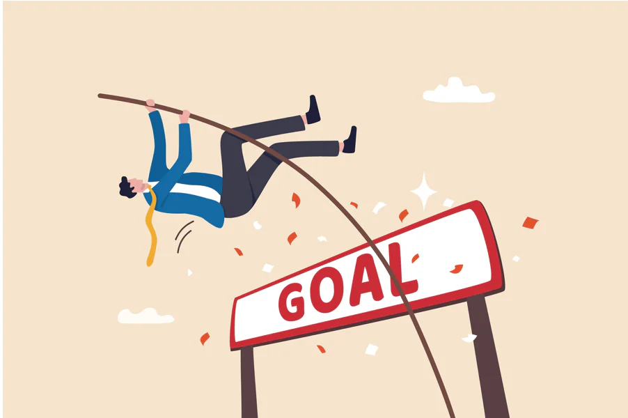 Persona che supera una barra con la scritta goal usando il salto con l’asta, simbolo di superamento delle skill gap